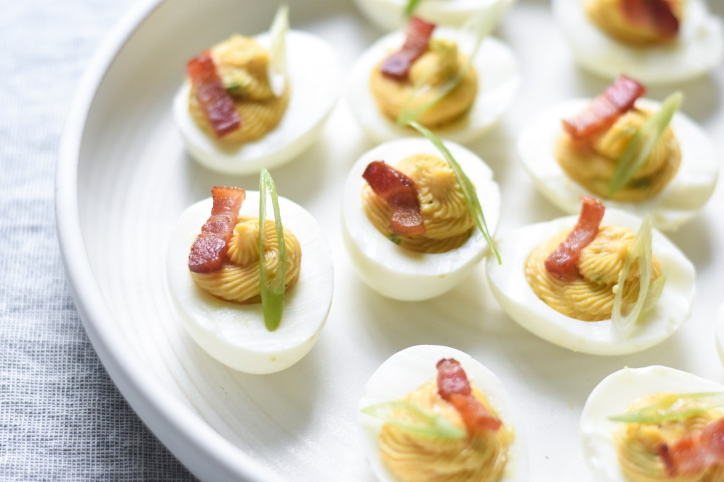 Bacon deviled eggs with creamy bacon fat yellow filling, low carb