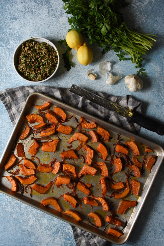 Roasted koginut squash and onions waiting to be topped with gremolata