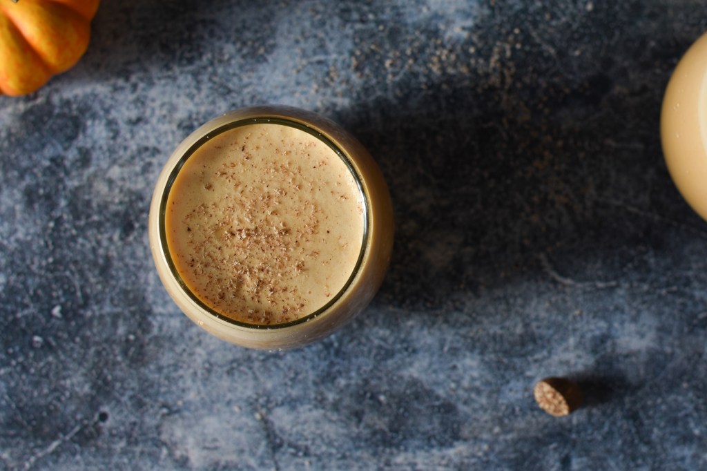 Pumpkin egg nog is toped with grated nutmeg. 