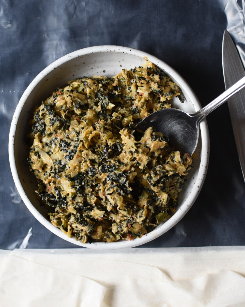 A mixture of kale, fontina, ricotta, and Mama Lil's peppers waits to go into phyllo. 